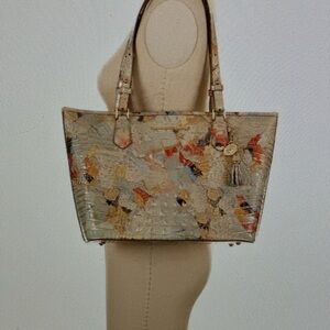 New with tags.  Comes with original dust bag.  Beautiful lightweight & roomy.